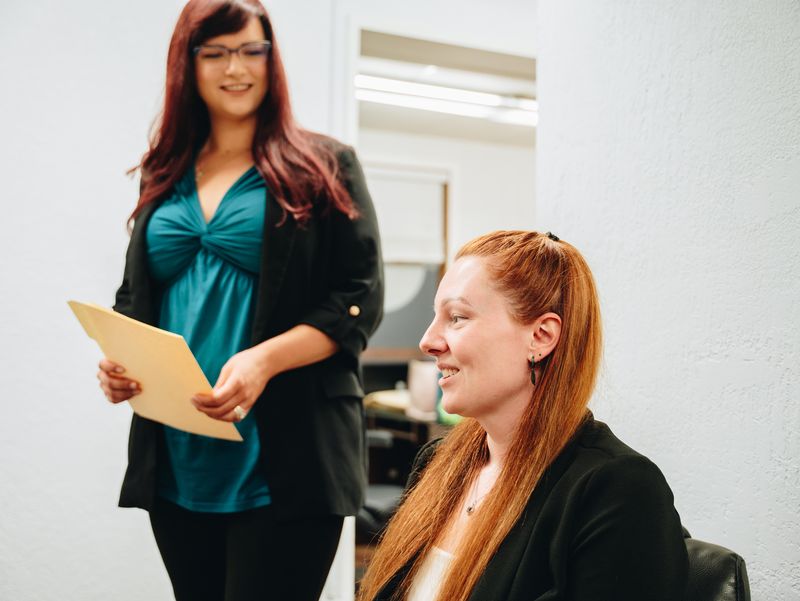 Two team members reviewing a document, DM Tax & Bookkeeping