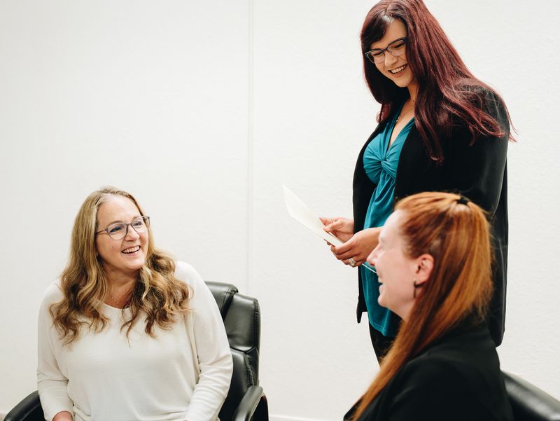 Handing over a document in the office, DM Tax & Bookkeeping