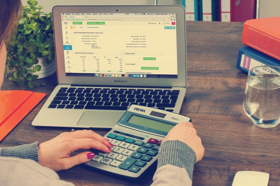 Accountant working with a laptop and calculator