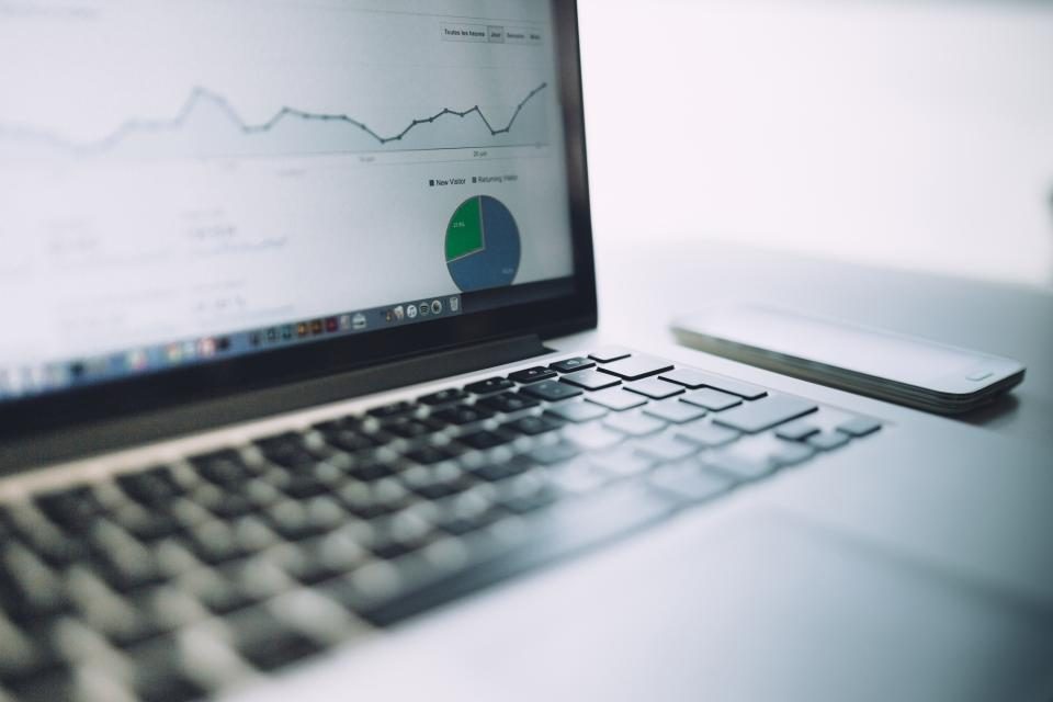 Reviewing search analytics on a laptop