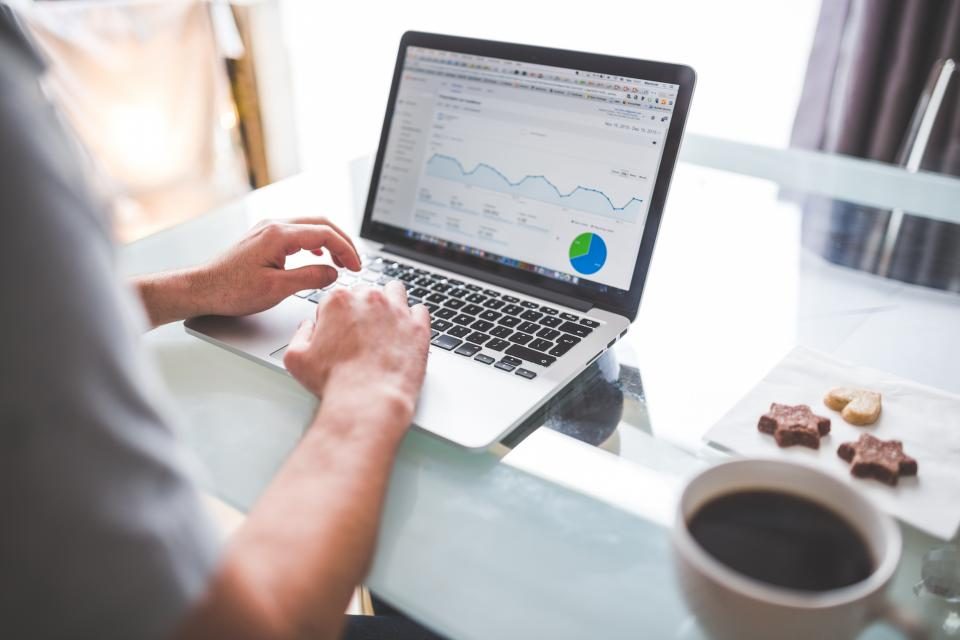 Laptop showing an advertising analytics dashboard