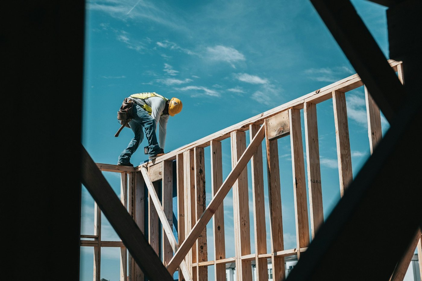 Contractor working on a building frame on site
