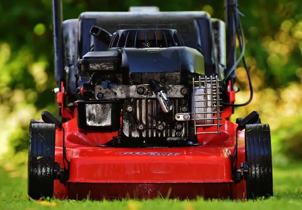 A lawn mower on cut grass