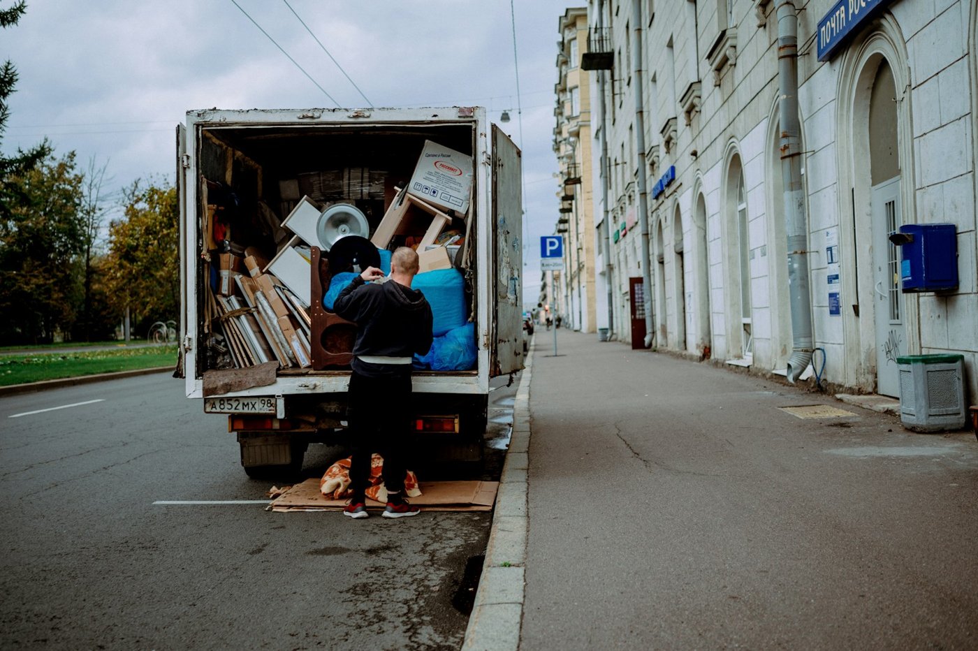 Movers loading furniture into a moving truck