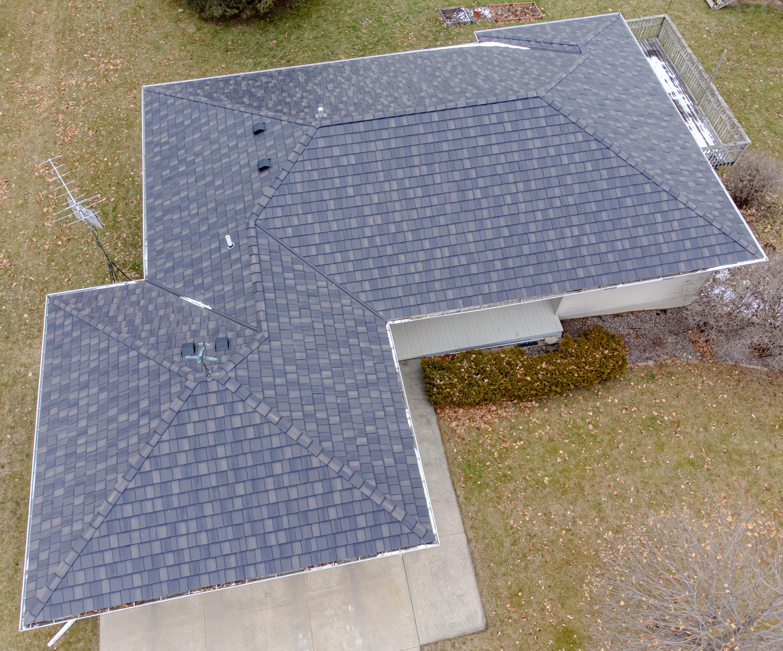 Aerial view of a freshly shingled residential roof