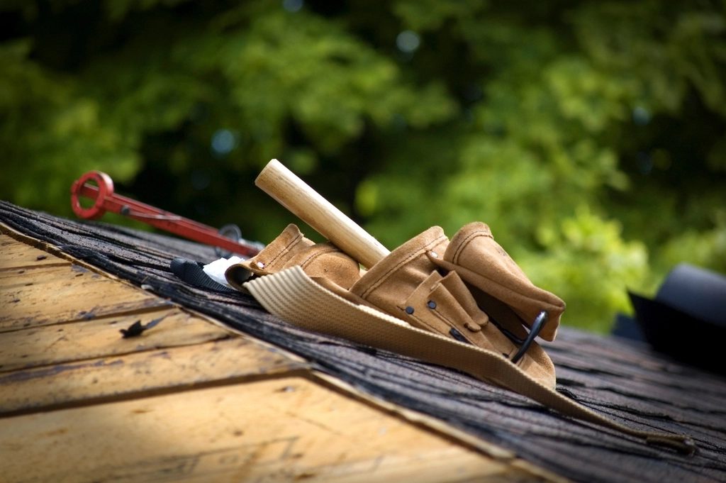 Roofing shingles and tools on a roof